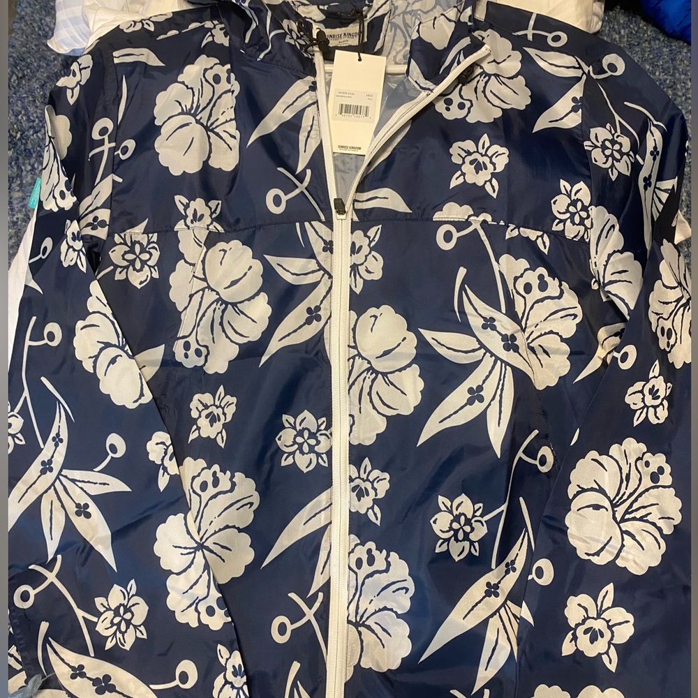 Adorable, feminine rain jacket with hood. Brand new
